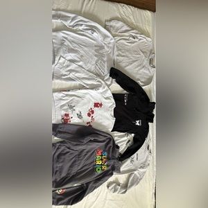 Bundle of sweaters and hoodies